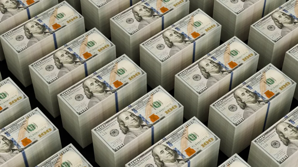 Stacks of hundred dollar bills are shown