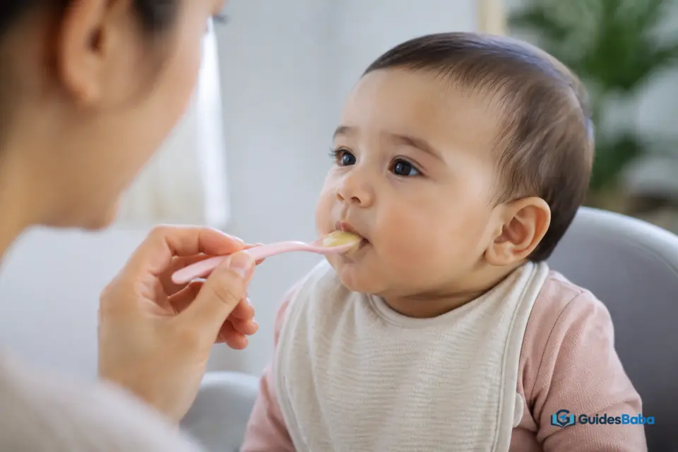 Baby opening their mouth for a spoonful of food