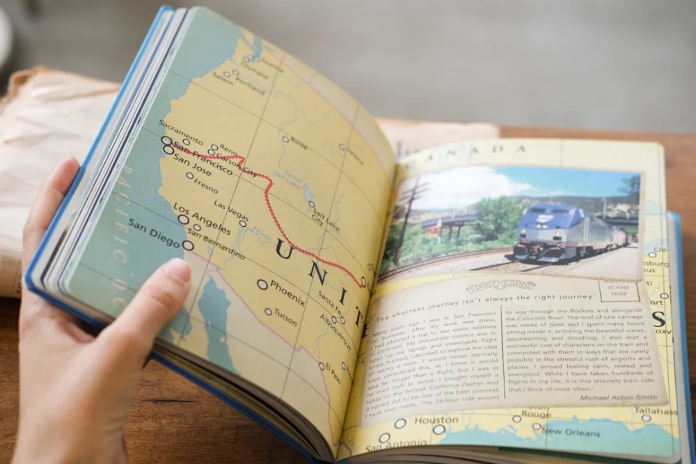 A person flips through a travel journal