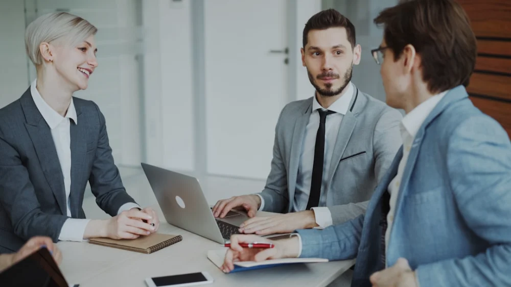 Business professionals in a meeting around a table