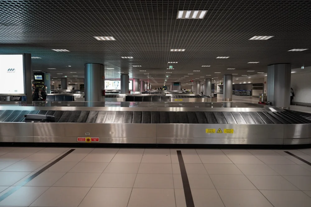 an empty baggage claim area at an airport