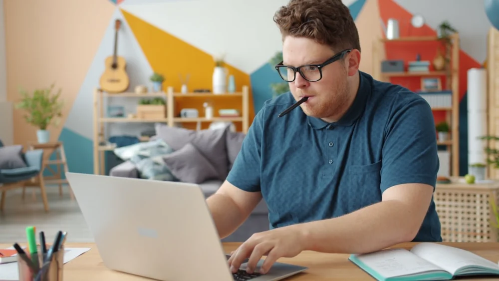 Man working on a laptop at a desk