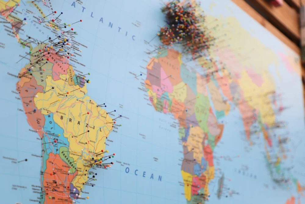 a map of the world with pins on it