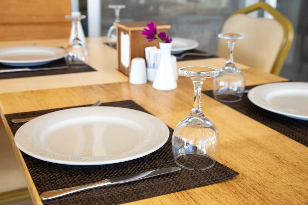 clear wine glass on brown wooden table