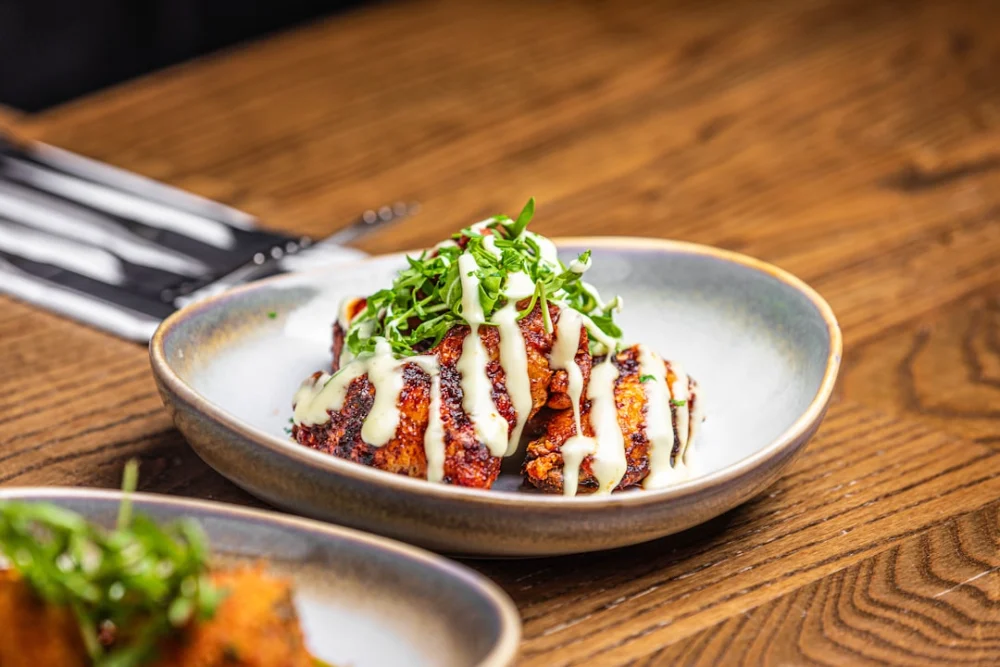 a plate of food on a wooden table