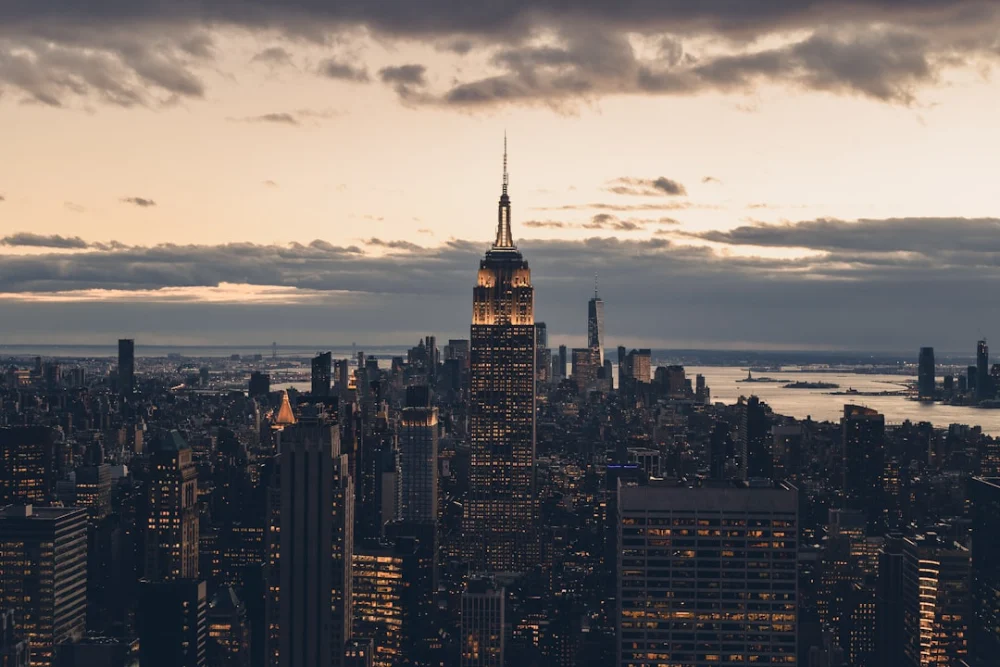 a view of a city at night from the top of a building