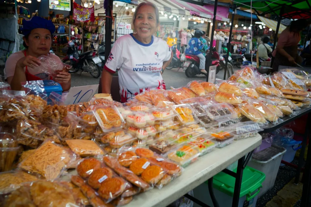 Vendors selling baked goods at an outdoor market