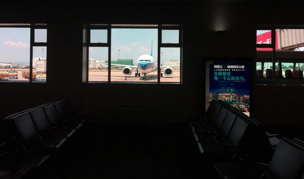 a plane is parked in an airport terminal