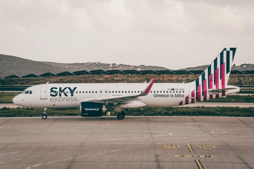 a large jetliner sitting on top of an airport tarmac