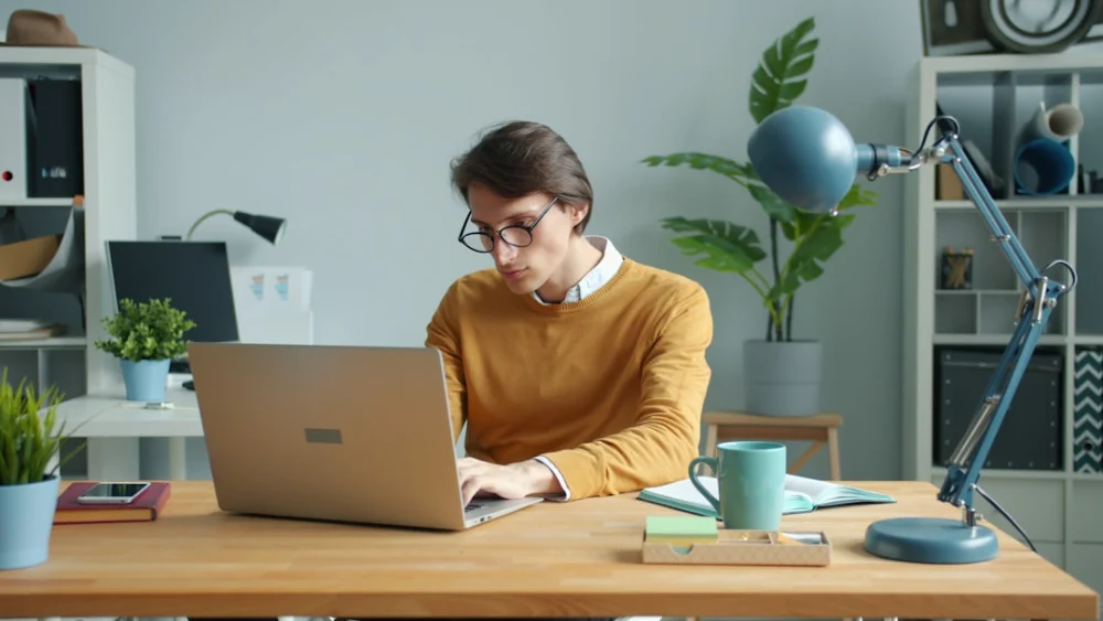 Man working on laptop at a desk