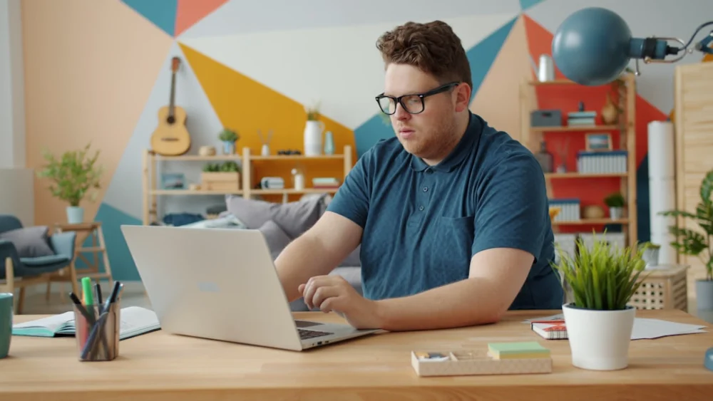 Man working on a laptop at a desk