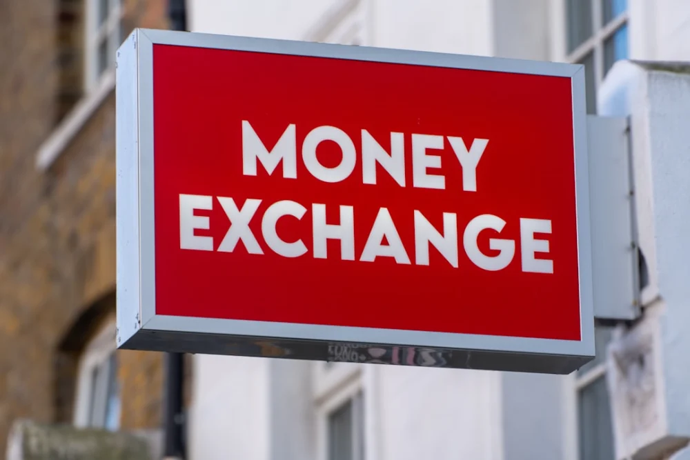 Red sign reads "money exchange" in white letters"