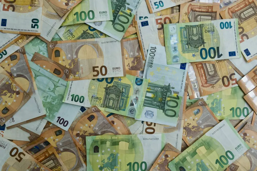Scattered euro banknotes of 50 and 100 denominations