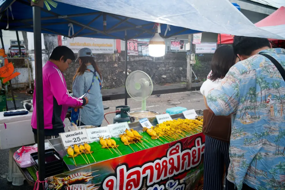 Street food stall with skewers of food
