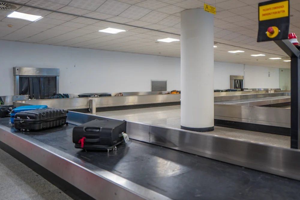 Luggage on a conveyor belt at an airport baggage claim