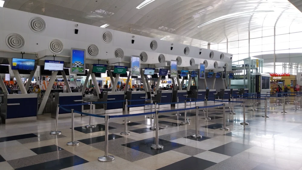 An airport with a check in area and a check in counter