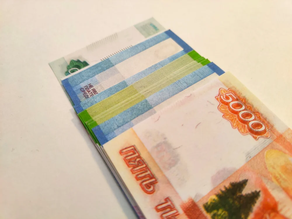 a close up of a bunch of money on a table