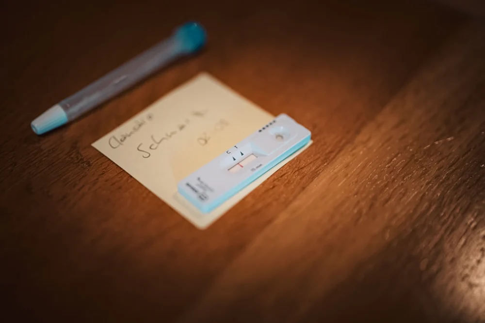 a note with a pen sitting on top of it